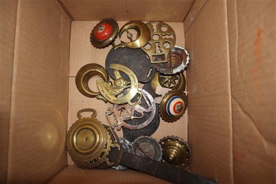 A group of horse brasses
